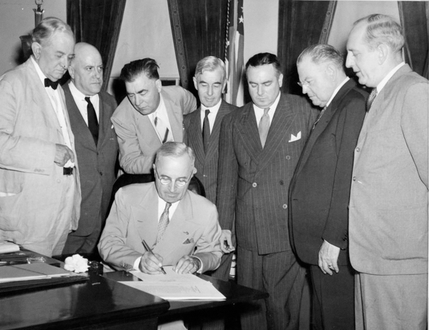 President Truman signs the Atomic Energy Act of 1946.